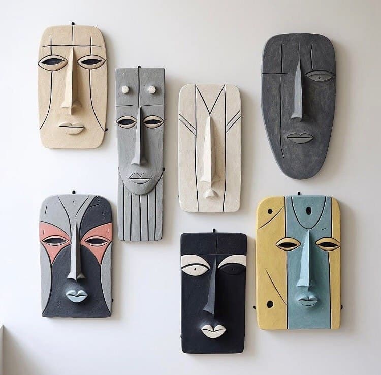 A curated arrangement of contemporary African-inspired wall masks
