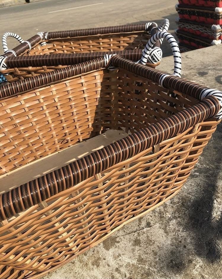 Handwoven market-style basket with wrapped handles