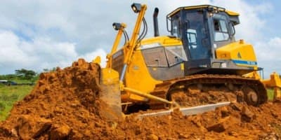 Yellow earthmoving machinery at work